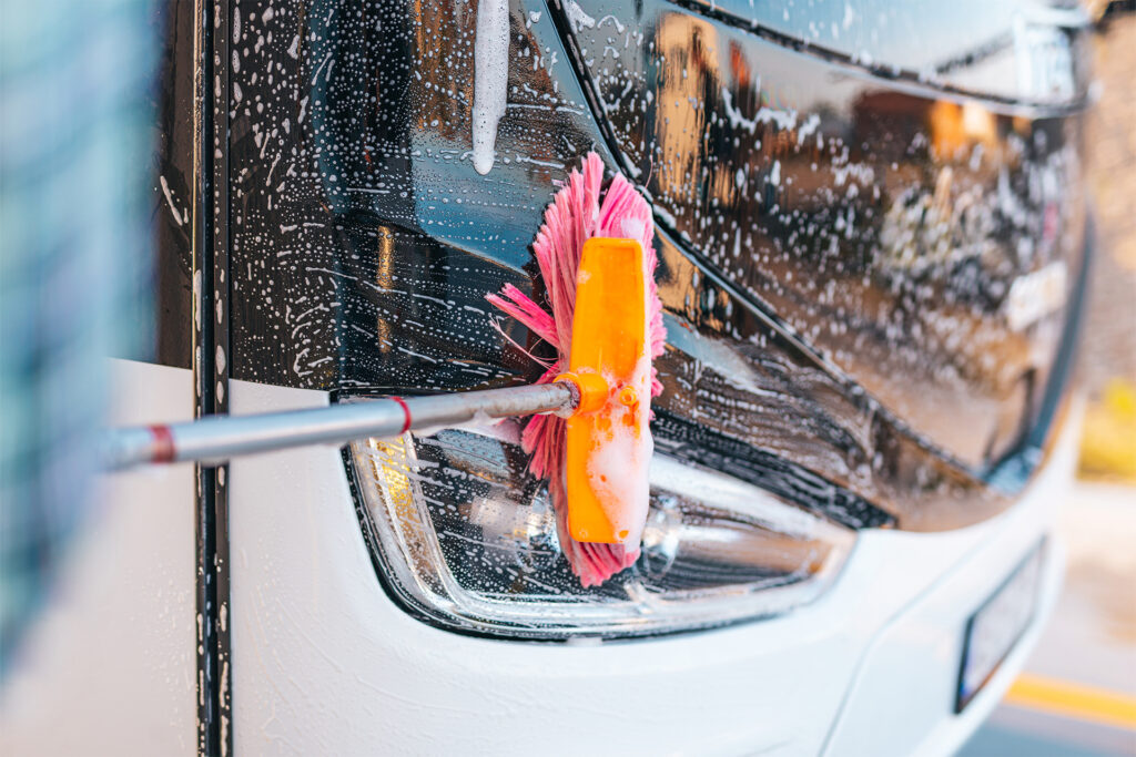 a close up of cleaning buses