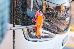a close up of cleaning buses